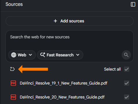 A dark-themed user interface snippet from NotebookLM showing a "Sources" panel. An orange arrow points directly to a circular counter-clockwise refresh/reset icon on the left. To the right of the icon, the text "Select all" is checked. Below it, two PDF files titled "DaVinci_Resolve_19_1_New_Features_Guide.pdf" and "DaVinci_Resolve_20_New_Features_Guide.pdf" are listed with checkmarks next to them.